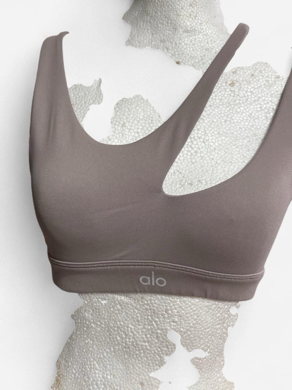 ALO Yoga Peak Sports Bra in Taupe.
